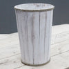 A large rustic whitewashed albesia wood storage tub with vertical planks and natural rope trim edges