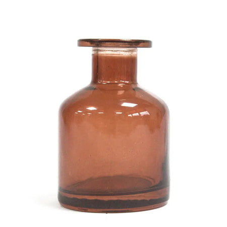 A sleek amber glass apothecary style reed diffuser bottle with a finish bottle stopper for bamboo reed diffuser use