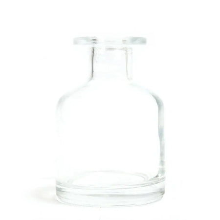 Clear glass apothecary style reed diffuser bottle with short neck rounded shoulders and finish bottle stopper