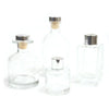 Clear glass apothecary style reed diffuser bottles with silver finish bottle stoppers and corks for bamboo reed diffuser use