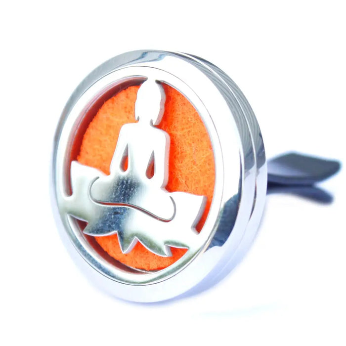 Silver stainless steel car air freshener with meditating buddha cutout on orange felt for aromatherapy diffuser kit