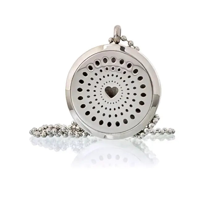 Silver aromatherapy diffuser necklace with heart cutout and perforated design on a beaded chain 30mm size