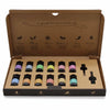 A set of ten aromatherapy essential oil bottles with black caps and colorful labels in a cardboard gift box autumn set