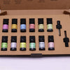 Set of ten 5 ml aromatherapy essential oil bottles with colorful labels and black caps in a cardboard box