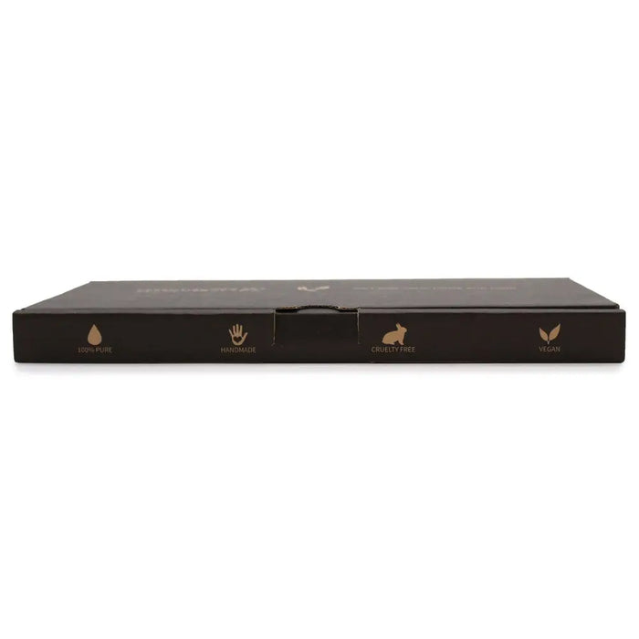 Black rectangular aromatherapy essential oil set box with gold foil accents showing handmade vegan and cruelty-free icons