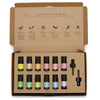 A set of ten aromatherapy essential oil bottles with black caps and colorful labels in a cardboard gift box