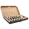 A colorful aromatherapy essential oil set with 12 labeled bottles in a cardboard gift box with black caps