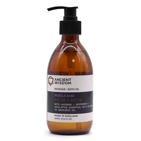 Amber glass bottle with black pump labeled ancient wisdom muscle ease massage and bath oil with eucalyptus essential oils