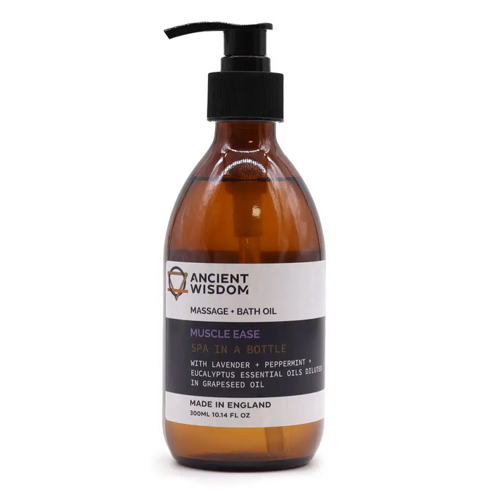 Amber glass bottle with black pump labeled ancient wisdom muscle ease massage and bath oil with eucalyptus essential oils