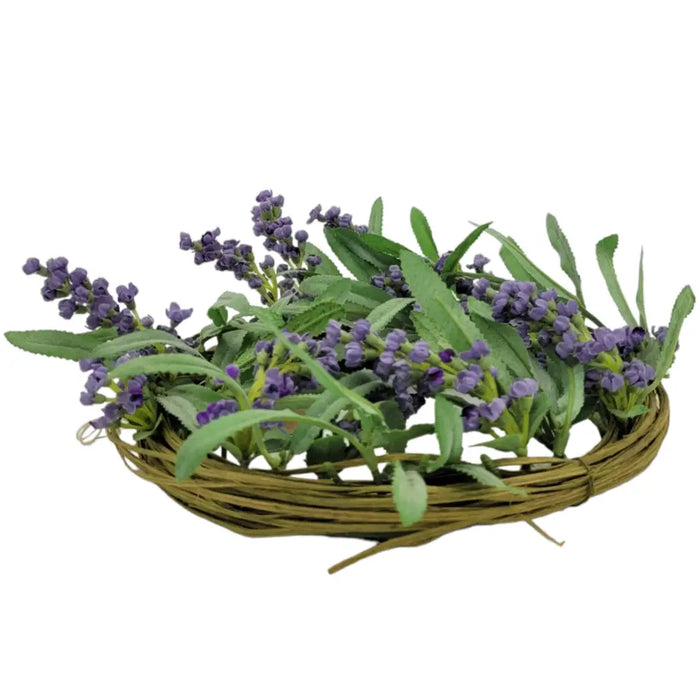 A woven wicker basket with artificial lavender purple sprigs and green leaves for church pillar decoration