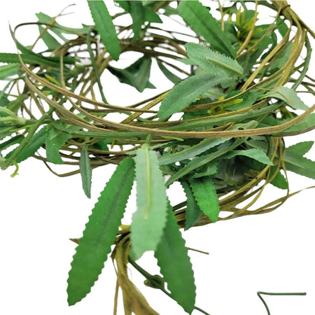 A rustic green and brown artificial leaf wreath made of woven vines and synthetic foliage for artificial lavender decor