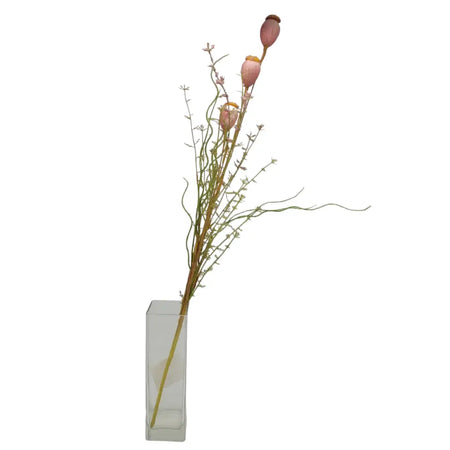 A tall arrangement of artificial dusky pink poppy pods and green stems in a clear rectangular glass vase