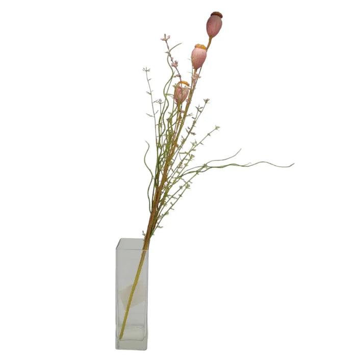 A tall arrangement of artificial dusky pink poppy pods and green stems in a clear rectangular glass vase