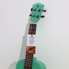 Artisanal mint green ukulele with a dark wood fretboard and black tuning pegs featuring a turquoise finish