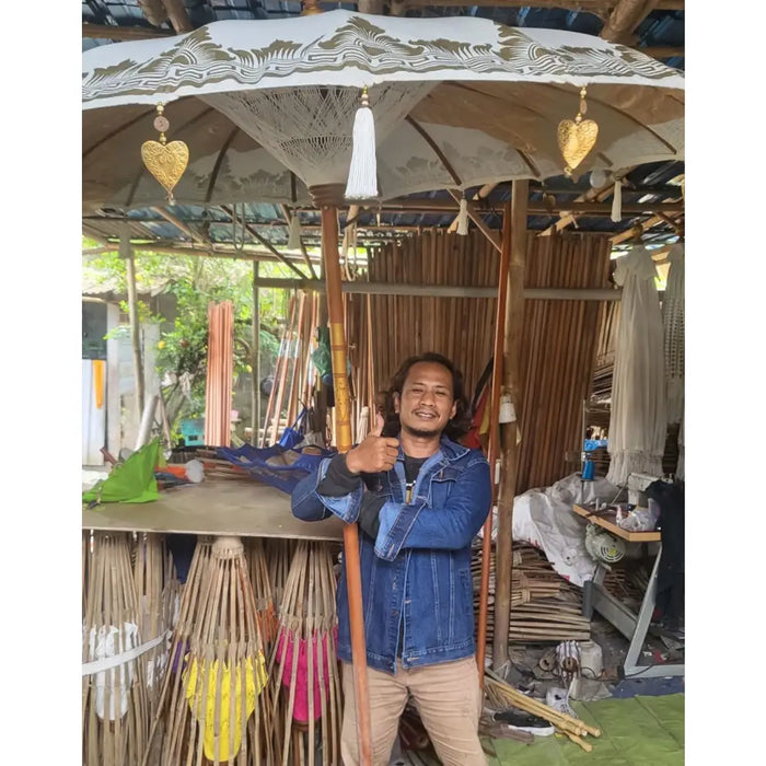 White umbrella patio parasol with gold leaf pattern on canopy and hanging golden heart ornaments, 2m orange canvas