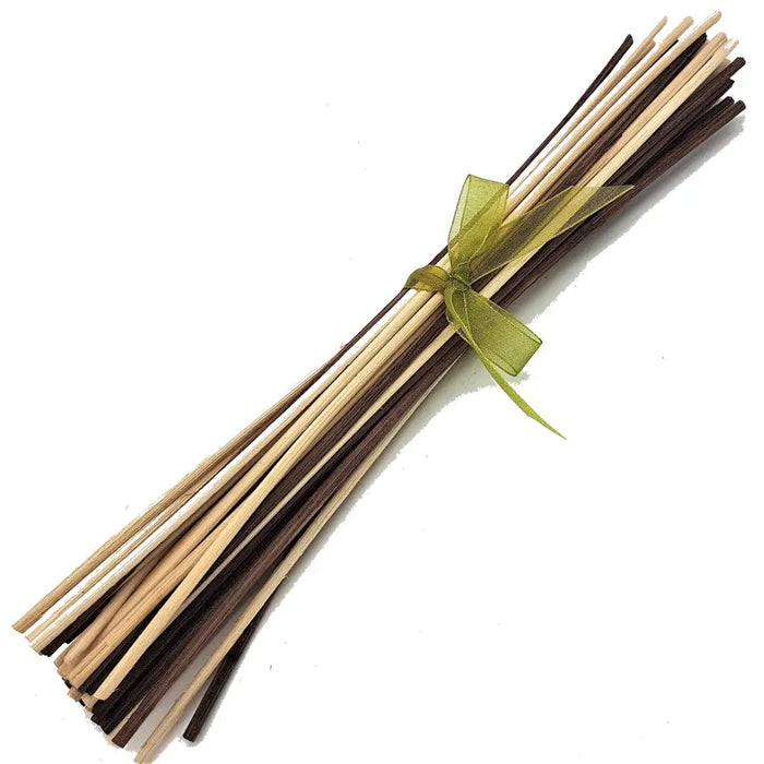 A bundle of natural wood bamboo diffuser sticks tied with a sheer green ribbon showing color choice options