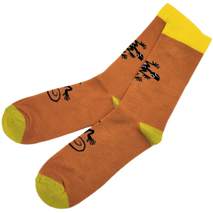 Orange bamboo socks with black lizard designs and yellow toe and heel accents in assorted patterns for adults