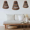 Three woven banana leaf lamp shades in natural brown with dark gray bands in tiered conical shapes