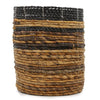Handwoven cylindrical basket with braided dark brown and tan fibers in a banana leaf set including vases and bins