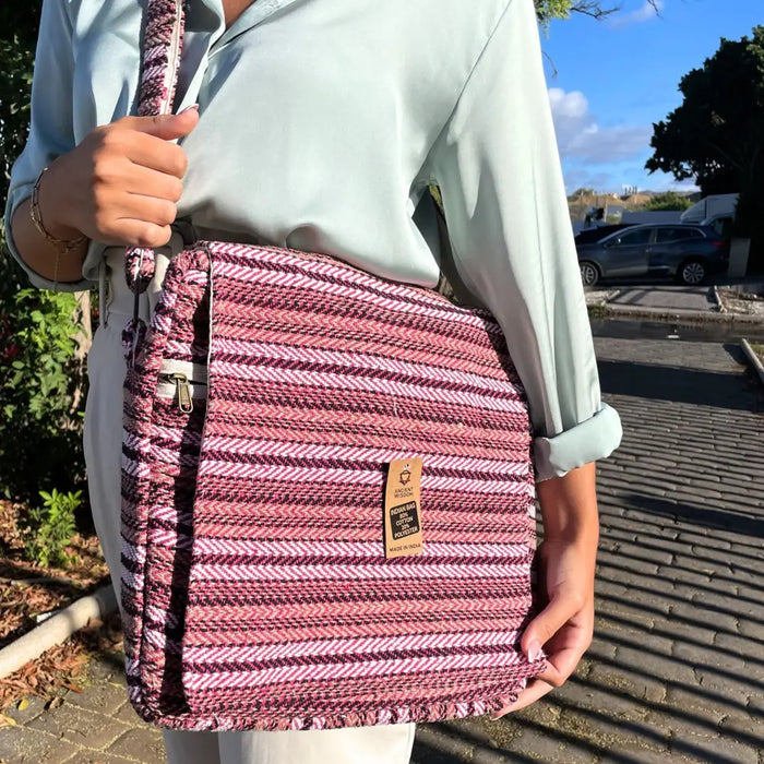 Banjar laptop bag with pink and white striped woven fabric and frayed edge shoulder strap design