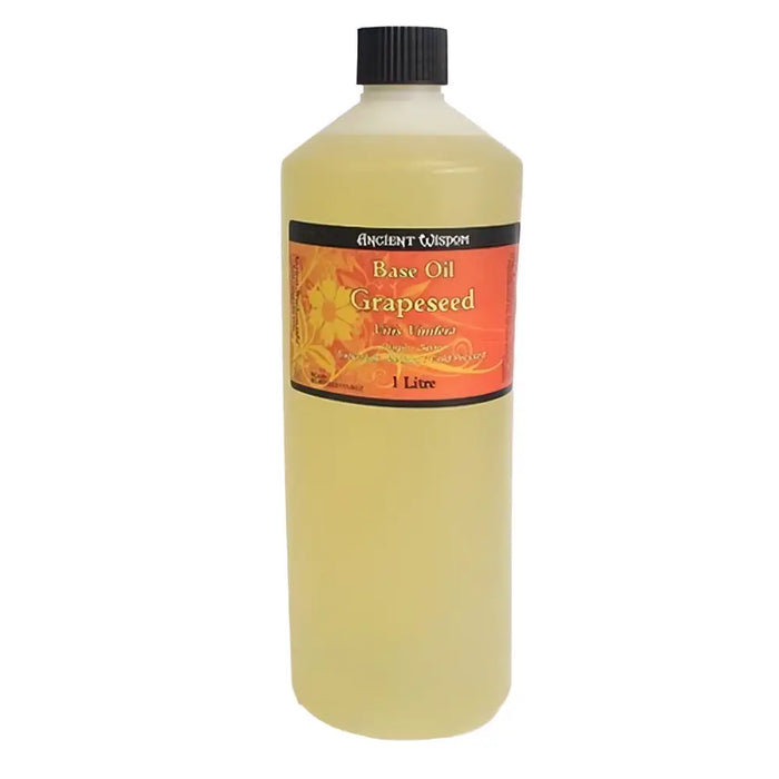 A 1 litre bottle of ancient wisdom grapeseed base oil with black cap and orange floral label rich in fatty acids