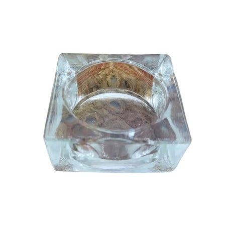 Basic square clear glass tealight holder with a textured faceted design and rounded interior glass tealight holder