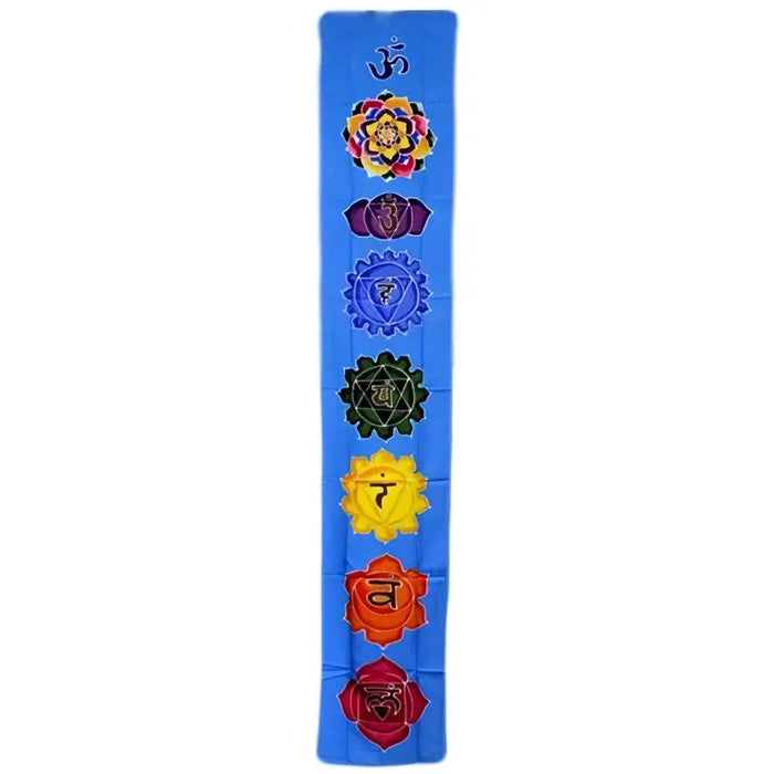 Blue batik drop banner made of fabric with seven colorful embroidered chakra symbols arranged vertically