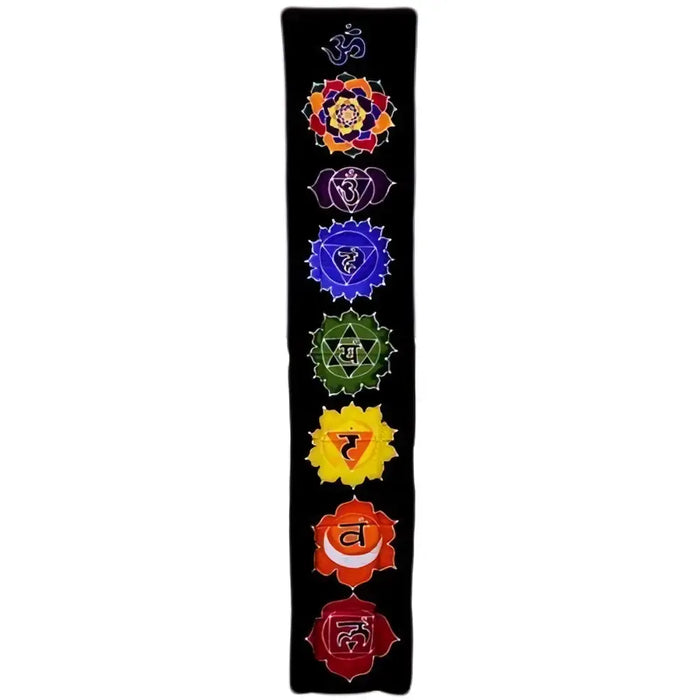 Black embroidered batik drop banner with seven colorful chakra symbols arranged vertically on a midnight background