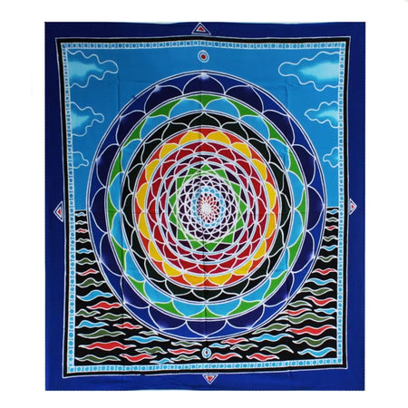 Vibrant blue batik wall hanging tapestry with colorful concentric mandala and cloud motifs in rainbow hues