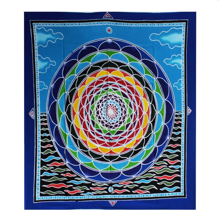 Vibrant blue batik wall hanging tapestry with colorful concentric mandala and cloud motifs in rainbow hues
