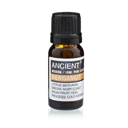 A small amber glass bottle with black cap labeled ancient wisdom bergamot essential oil 10ml for aromatherapy use