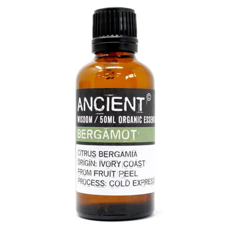 A 50ml amber glass bottle of ancient wisdom bergamot essential oil with a black cap and label from ivory coast