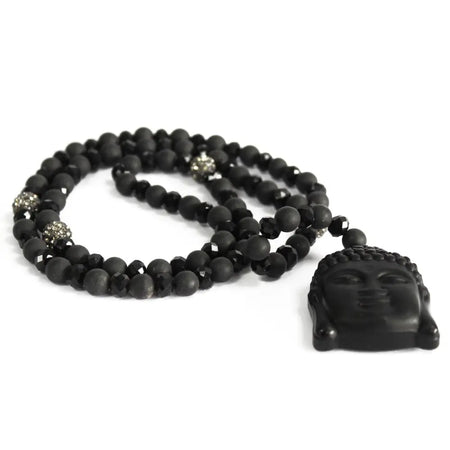 Black agate necklace with a matte buddha head pendant and alternating faceted black beads with crystal accents