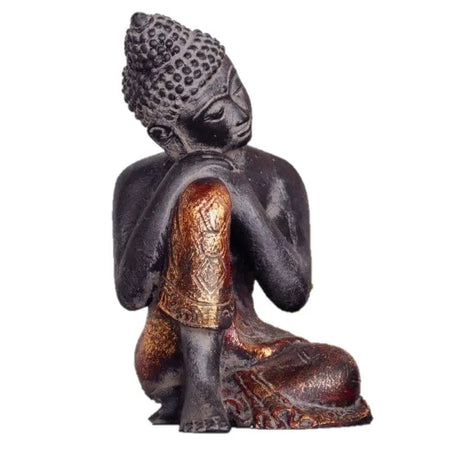 Dark bronze resting buddha statue with intricate gold leaf detailing on robes and head in a meditative pose