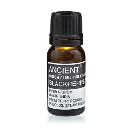 A small amber glass bottle of black pepper essential oil with a black cap and a white ancient wisdom label