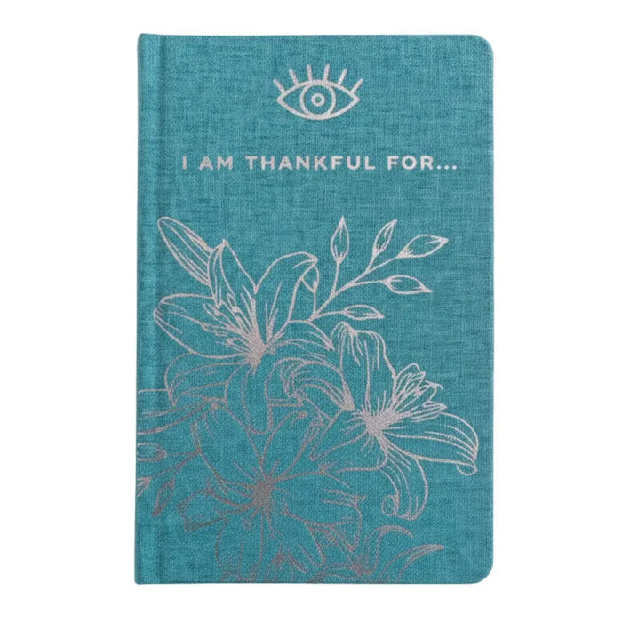 Blue gratitude journal with teal textured cover silver foil i am thankful for phrase and white embroidered eye floral design