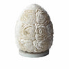 A white boho sea shell lamp shaped like an egg with rose oval 15cm pattern made of arranged seashells