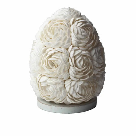 A white boho sea shell lamp shaped like an egg with rose oval 15cm pattern made of arranged seashells