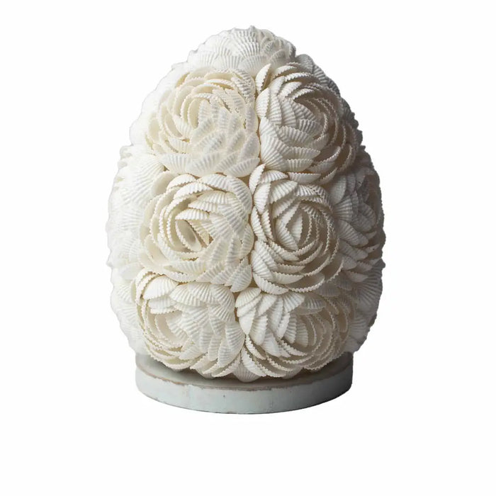 A white boho sea shell lamp shaped like an egg with rose oval 15cm pattern made of arranged seashells