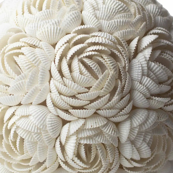 A boho sea shell lamp rose oval 20cm made of white ceramic with ridged cupcake liners arranged like a rose