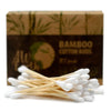 Box of 200 bamboo cotton buds with natural wooden sticks and white cotton tips in a brown cardboard box with bamboo leaves