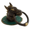 Antique brass door knocker with a horse head design on a green enamel base with gold accents
