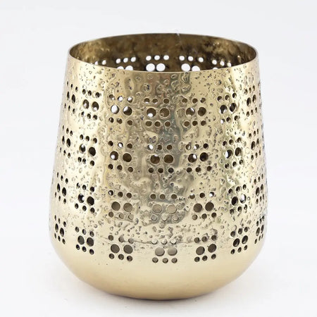 Brass-finish candle holder with hammered texture and circular perforations in gold-toned metal, 19cm tall