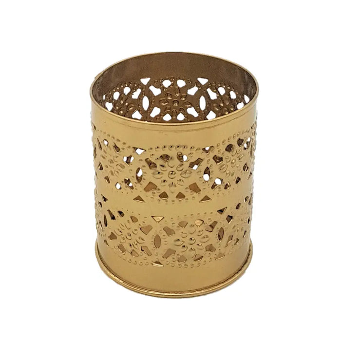 Gold-colored brass-finish cylindrical tealight holder with intricate cut-out patterns for decorative use