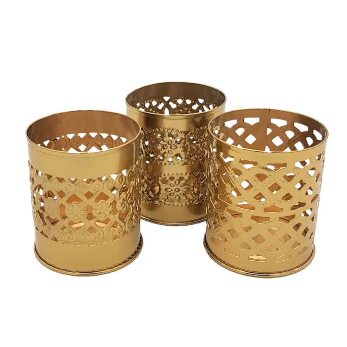Gold-colored brass-finish decorative kasbah tealight holders with intricate cut-out metal patterns
