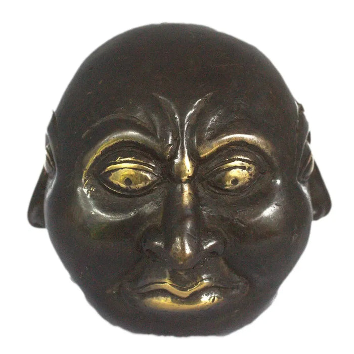 Dark bronze brass mask with gold inlaid eyes and lips showing a stylized facial expression 10cm tall