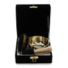 Golden brass tibetan singing bowl with black velvet box mallet and decorative cushion in a brass singing bowl gift set