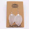 Bravery leaf earrings silver with intricate vein detailing and a delicate translucent finish in silver metal