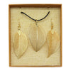 Gold leaf-shaped pendant necklace and matching earrings with vein details on black cord gift set
