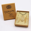 Bravery leaf gold necklace and earring set with gold leaf design displayed in a brown gift box